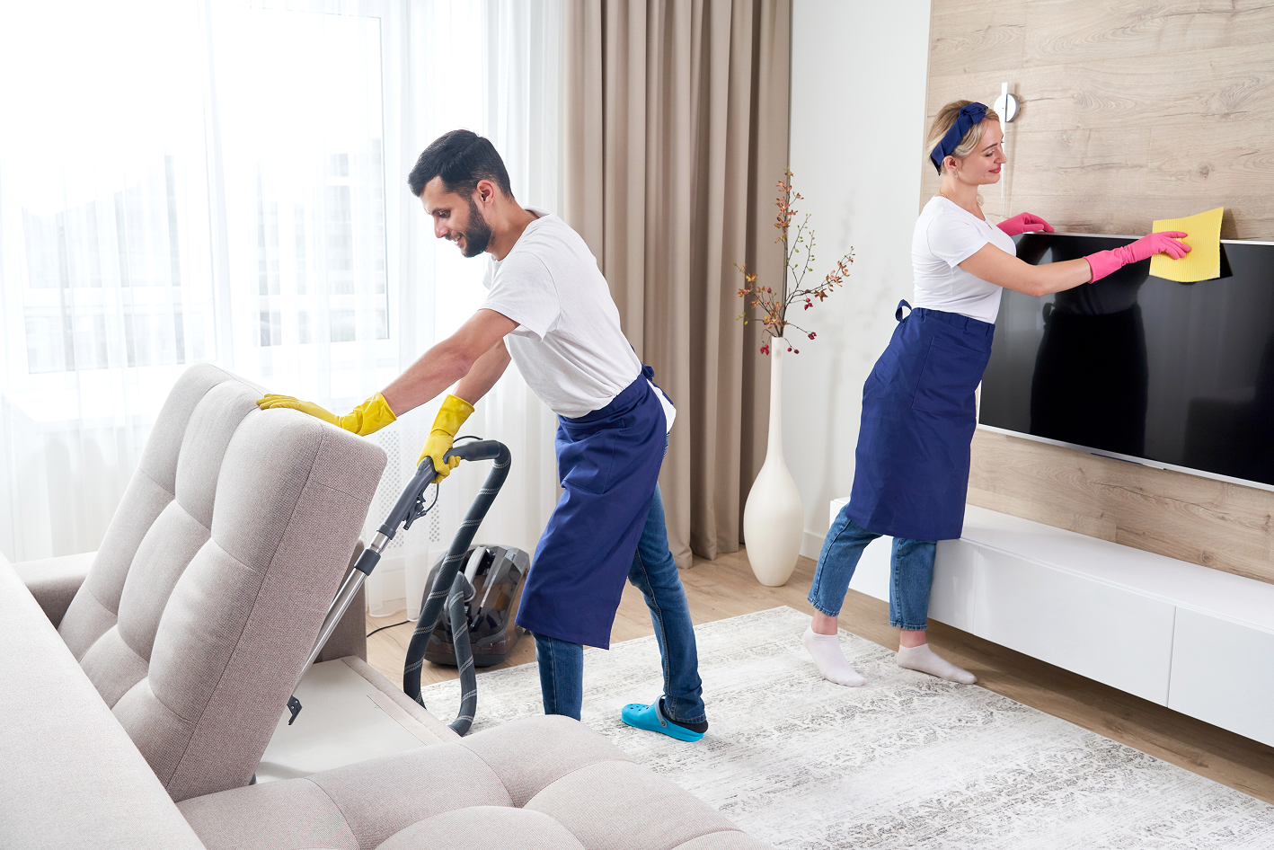 professional-cleaners-blue-uniform-washing-floor-wiping-dust-from-furniture-living-room-apartment-cleaning-service-concept